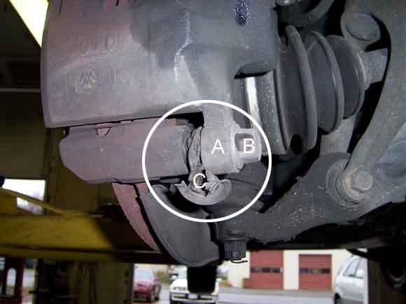 Brake caliper with a punctured dust boot